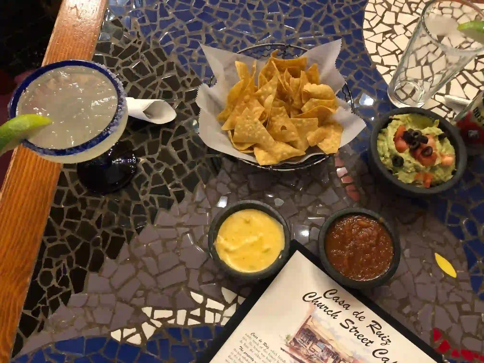 Church Street Cafe table with a menu and a bowl of chips